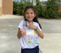 Student exploring worms at school