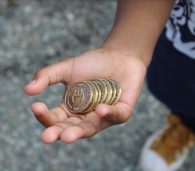Hand holding Breadcoin tokens